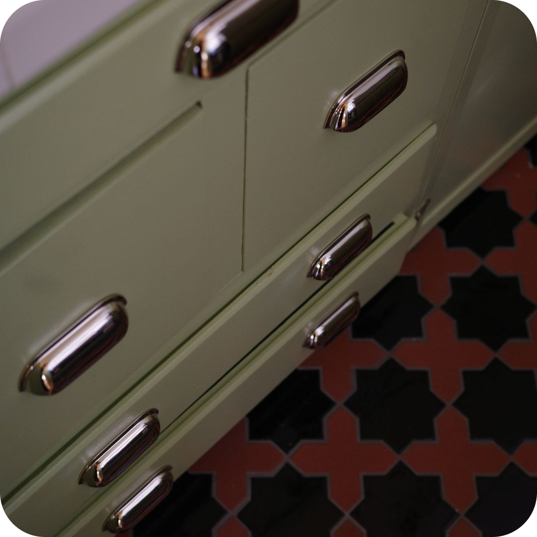 Polished Nickel Cup Pulls on Sage Green Kitchen Cabinets