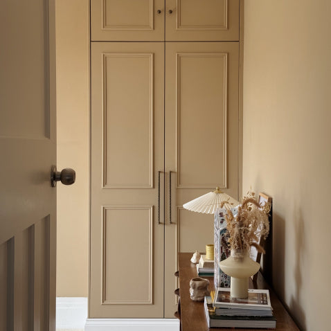 Butterscotch bedroom wardrobes with antique brass bobbin hardware