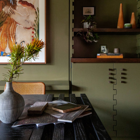Moss green home office with antique brass hardware